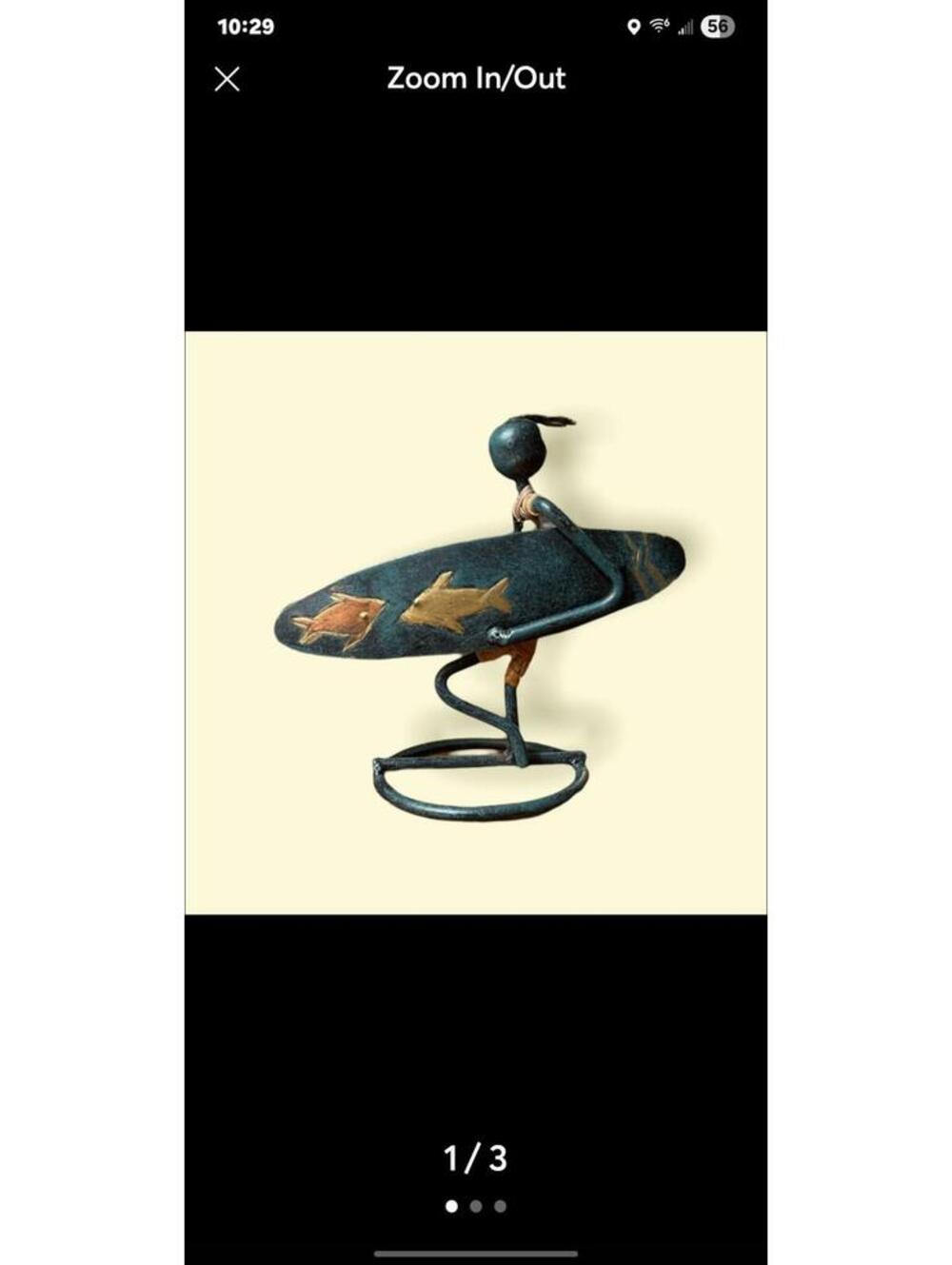 Handmade metal surfer & surfboard approx. 5” tall and 5 1/2” wide.